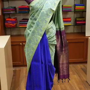 Elachi green and royal blue partly pallu kanchi silk saree with prints